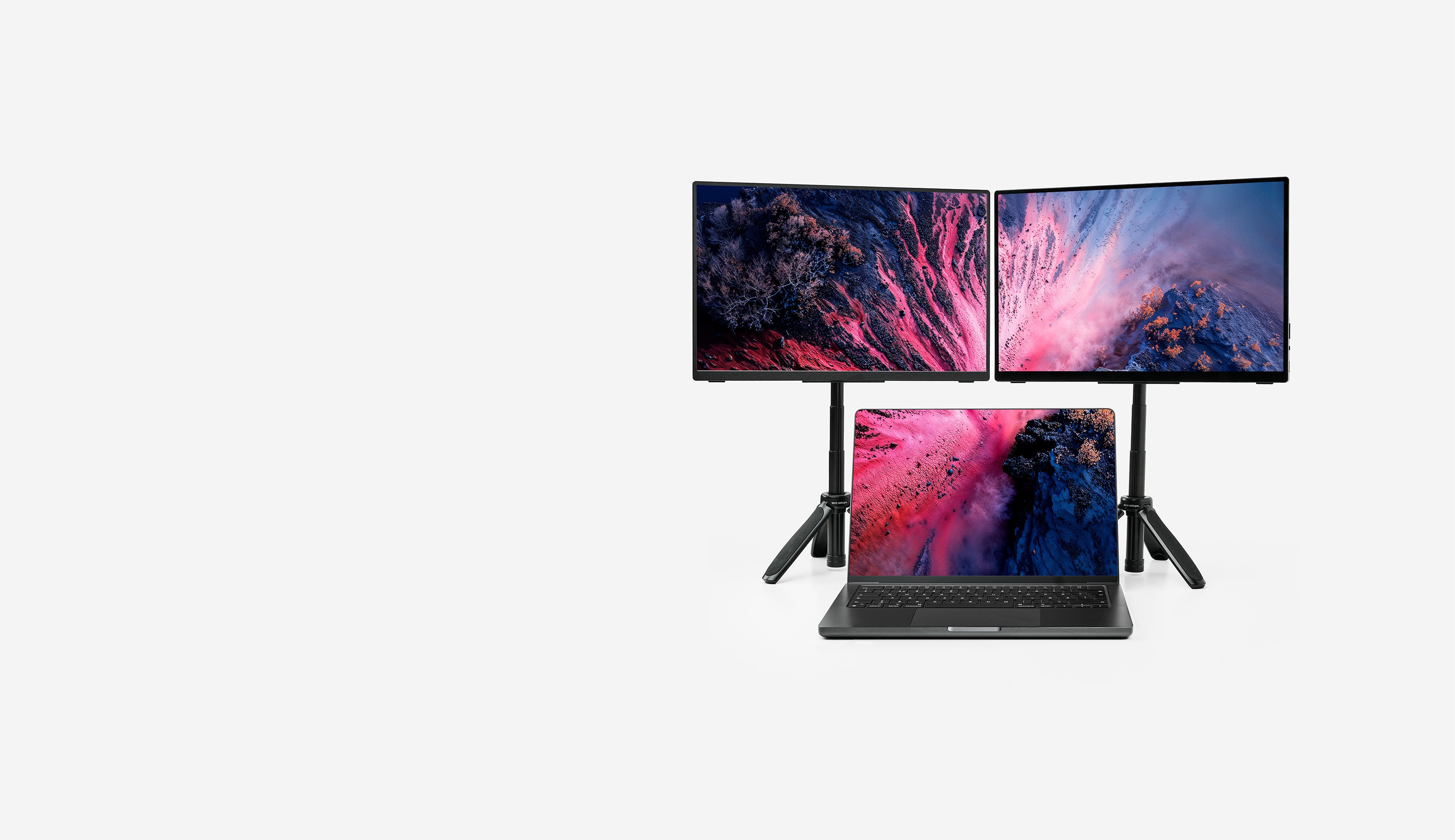 Two portable monitors on top of a laptop